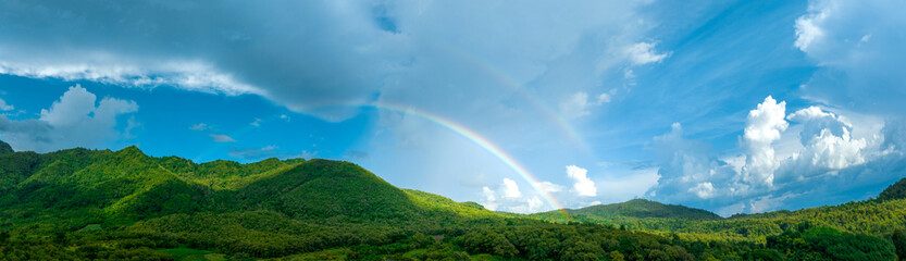 Rainbow on Sky in the mountains, Panorama of flying in a Nature rainbow in the rain, aerial view of...