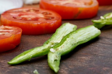 Healthy organic vegetables of Onion, Tomato, Chili cuts into pieces for cooking in the kitchen. Natural ingredient for lunch preparation in restaurant.