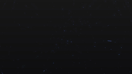 Abstract blue particle background for new year videos, celebration videos, etc in floating blue colored sparks background in high resolution.