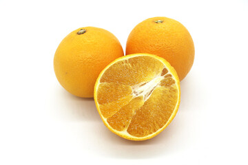 Fresh orange fruits isolated against a white background
