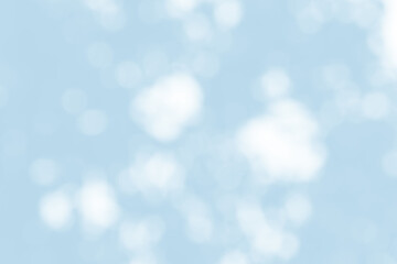 Abstract light blue blur bokeh for background, light blur on high light blue gradient abstract background in central design for presentation.