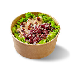 Salad with lettuce, chicken fillet, baked mushrooms and red beans with teriyaki sauce and sesame in paper bowl on white