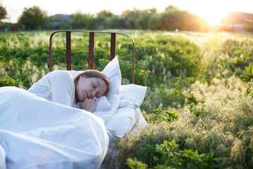 bed in a green field