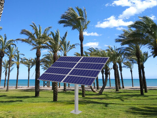 Solar panel cell on caribbean sunny beach background.