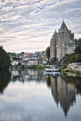 Fototapeta na wymiar Landscape view of the of the Oust river and the chateau castle of the medieval village of Josselin, Morbihan Department, Brittany Region, France