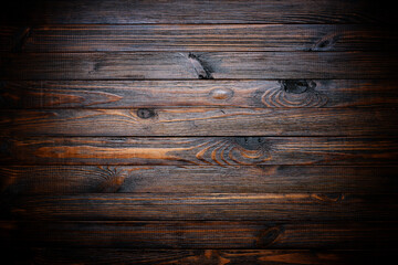 Dark stained wood texture, vignette wooden background