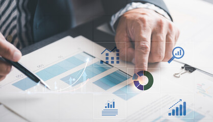 Businessmen analyze market reports with statistics from charts and graphs, managing business and financial strategies, professional analysts view investment information, consulting and presentations.