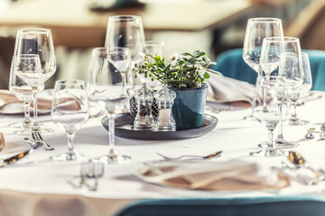 Luxury table with glasses, napkins and cutlery in restaurant or hotel
