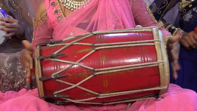 playing a dholak instrument girl, indian drums dholak, Women playing Indian musical instrument dholak, woman playing dhol, dholak, dholki, drum during festival