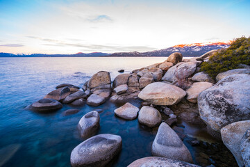 Fototapeta na wymiar beautiful Lake tahoe at sunset with reflection in water.
