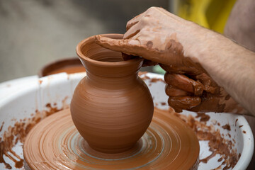 Fototapeta na wymiar Man making ceramic pot