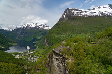 Beautiful view of the Geiranger Fjord and the town of Geiranger from the Adlerkehre with a cruise ship at anchor
