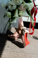 Wedding shoes with wedding bouquet