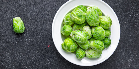 Obraz premium Brussels sprouts green raw vegetable healthy meal food snack diet on the table copy space food background 