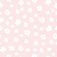 Seamless pattern of white hand drawn daisies in doodle style on a pink background. Romantic print for fabric, paper, t-shirt