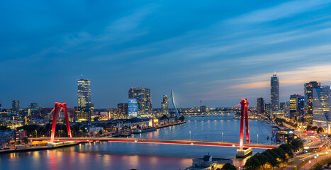 Sky line of Rotterdam at night over the river Maas