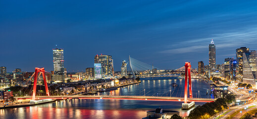 Sky line of Rotterdam at night over the river Maas