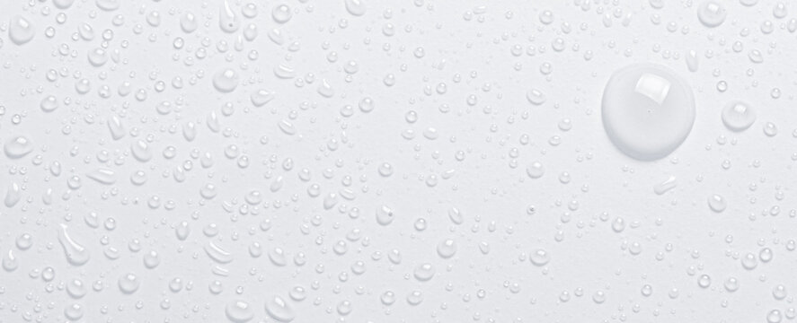 Drops of cosmetic micellar water or tonic. Closeup, macro photography. Copy space