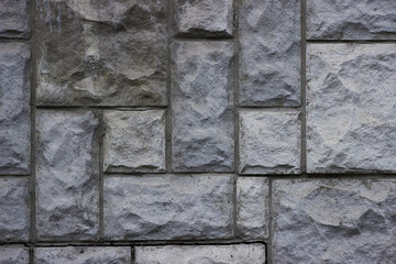 The texture of a stone brick. Stone texture made of different bricks. The texture of broken bricks.