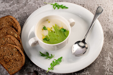 Fresh healthy green spinach cream soup. Vegan cuisine