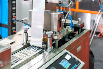 capsules wrapped in ptp sheet during manufacturing process by machine blister packing machine for pharmaceutical in industrial