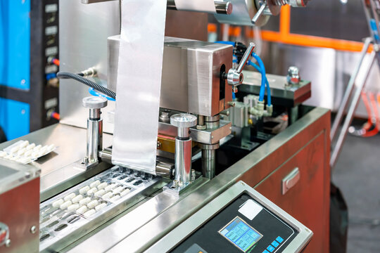 capsules wrapped in ptp sheet during manufacturing process by machine blister packing machine for pharmaceutical in industrial