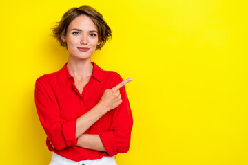 Portrait of nice cute gorgeous pretty woman with bob hairdo dressed red shirt directing empty space...