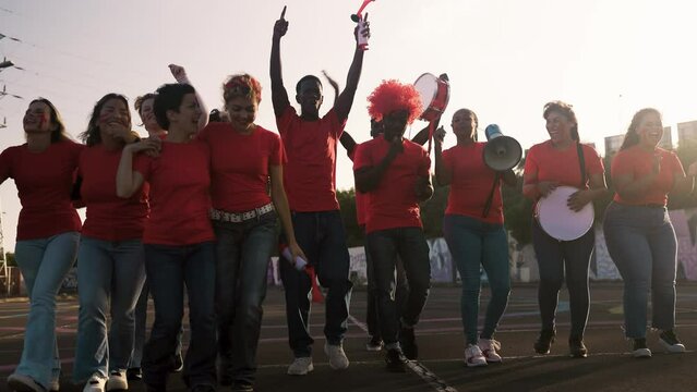 Crowd football fans walking to stadium for watching soccer game - Sport entertainment concept