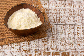 Powdered or dehydrated milk in the bowl