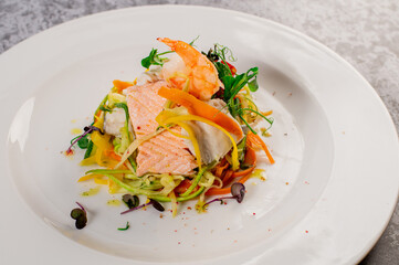 Diet dish of boiled salmon with vegetables. Vegetarian food. Detox menu. Healthy food