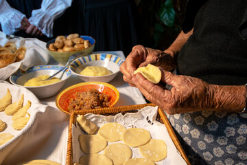 preparation of Sardinian culurgiones. Typical fresh pasta filled with potatoes and mint - obrazy, fototapety, plakaty