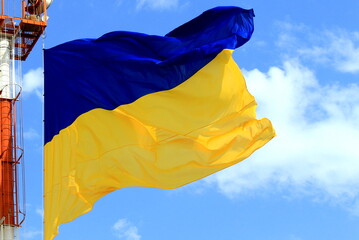 Flag of Ukraine flutters in sky. Large yellow blue Ukrainian national state flag, Kyiv Ukraine. Defender, Independence, Constitution Day