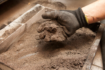 Used pellets in the form of ash, cleaning of an ecological pellet stove