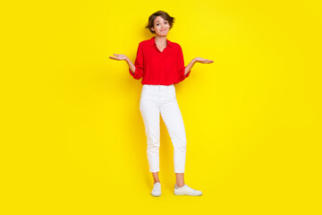 Full body portrait of indifferent lady arm shrug shoulders dont know isolated on yellow color background