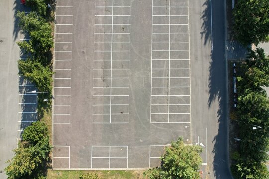 aerial panorama view of empty parking lot after cars left from the big town hearding to nature for weekend