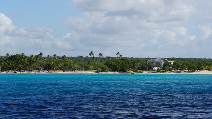 the beach view from the water between Playa Dominicus close to Bayahibe and Isla Saona in the Dominican Republic in the month of February 2022