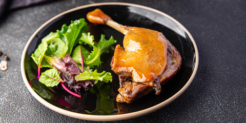 duck confit leg, red berry sauce  meal food snack on the table copy space food background 