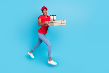 Full size portrait of positive funky person hold pizza package rush jump isolated on blue color background