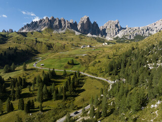 Alp adventure road hair pin twisty in the Dolomites, Italy. Aerial drone overview. Driving route...