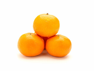 Pile of fresh oranges on a white background