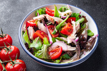 chicken breast salad tomato, green lettuce, red onion healthy meal food snack diet on the table copy space food background 