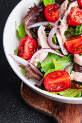 chicken breast salad tomato, green lettuce, red onion healthy meal food snack diet on the table copy space food background 