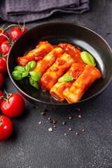 meat cannelloni pasta dish stuffed tomato sauce healthy meal food snack diet on the table copy space food background