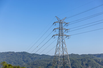 Obraz premium High voltage transmission towers line