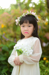 Portrait of cute unhappy little girl