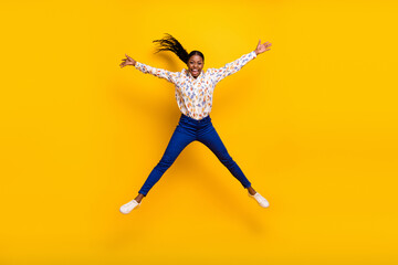 Fototapeta na wymiar Full length body size view of attractive cheery crazy girl jumping having fun isolated over bright yellow color background