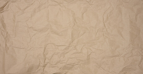 Texture of brown crumpled craft paper, full frame