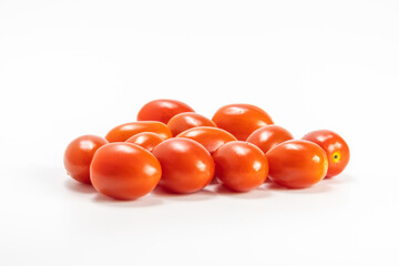 red cherry tomato stack isolated on white background.  small tomato support healthy vision and help protect against cancer.