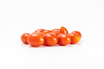 red cherry tomato stack isolated on white background.  small tomato support healthy vision and help protect against cancer.