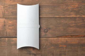 White blank doner kebab paper packaging on wooden table